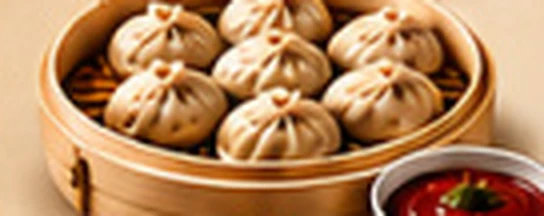 Steamed vegetable momos in a bamboo basket