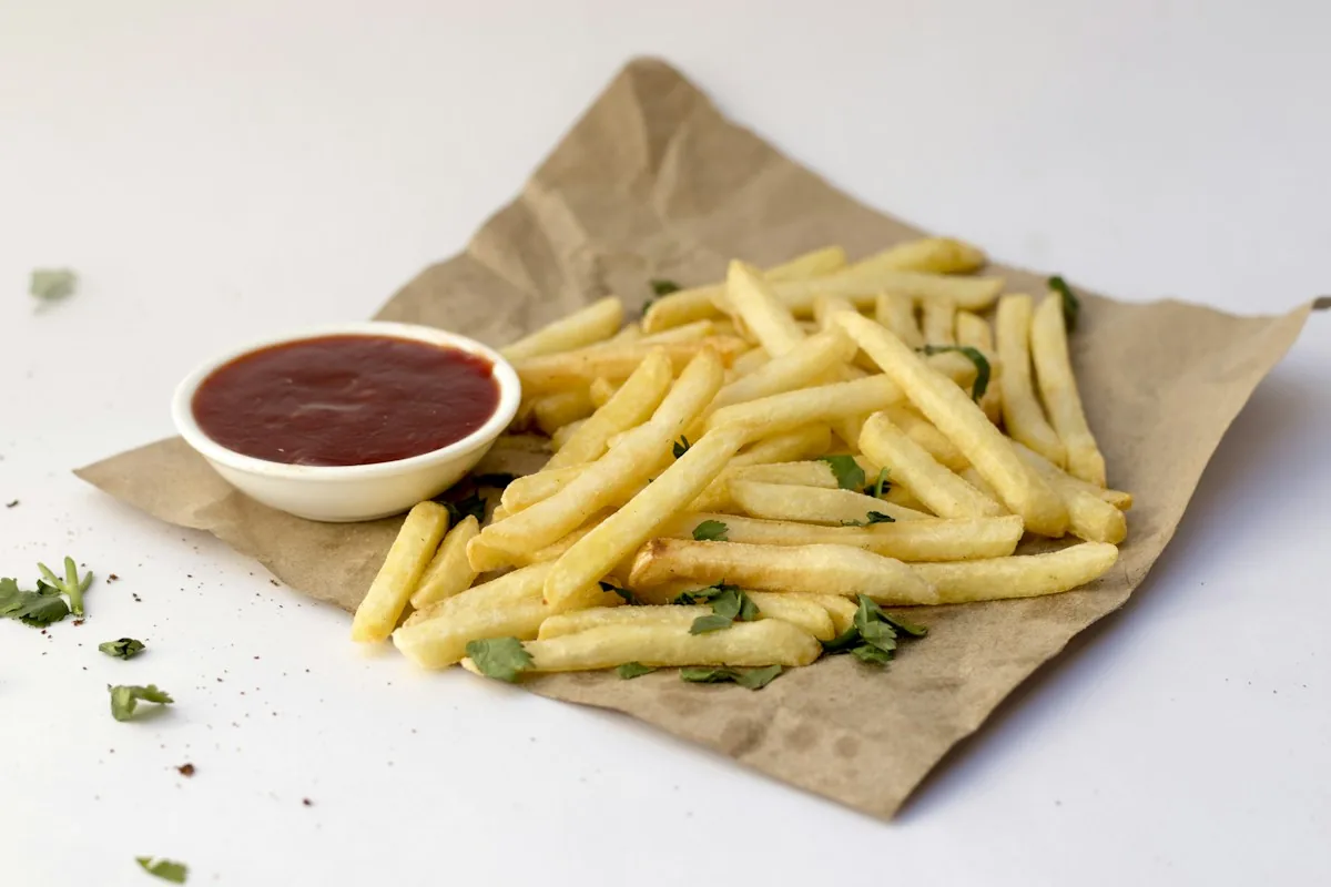 Golden french fries with ketchup