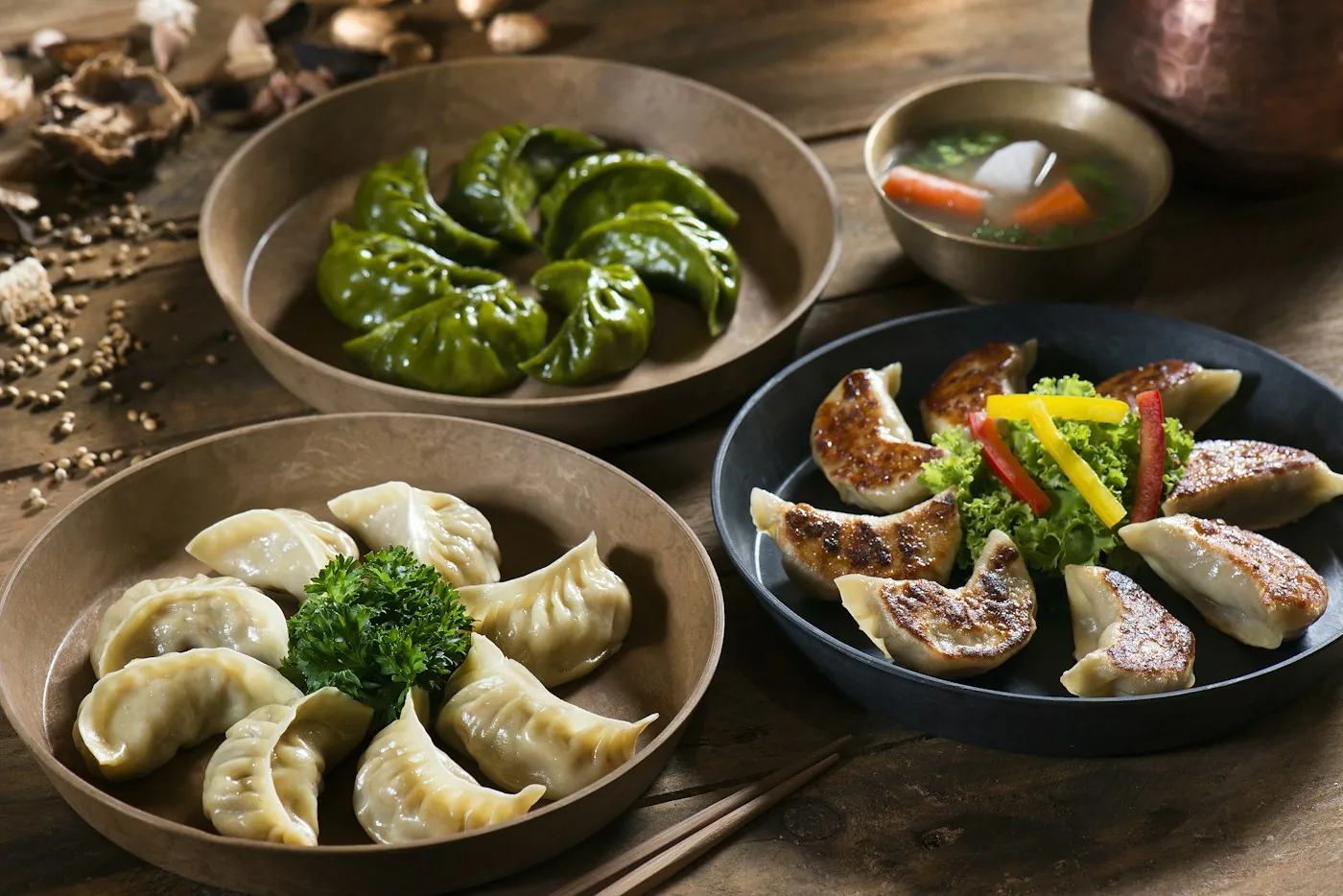 A table of steamed momos and dipping sauces